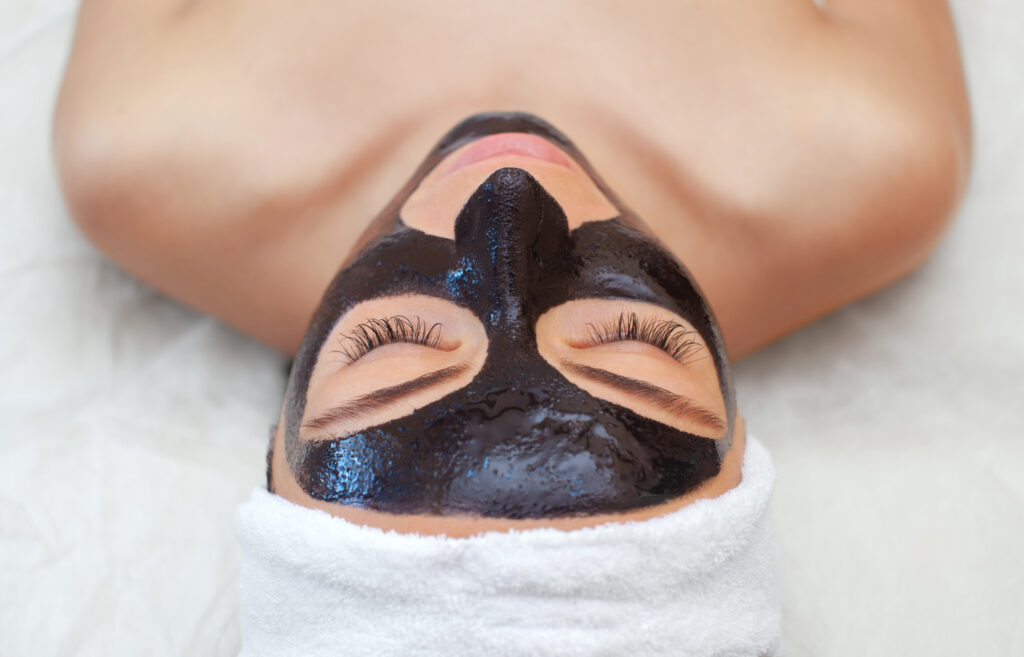 Woman at the spa being treated with V Carbon Peel